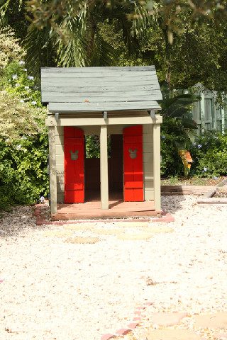 Wooden playhouse in the outdoor play area