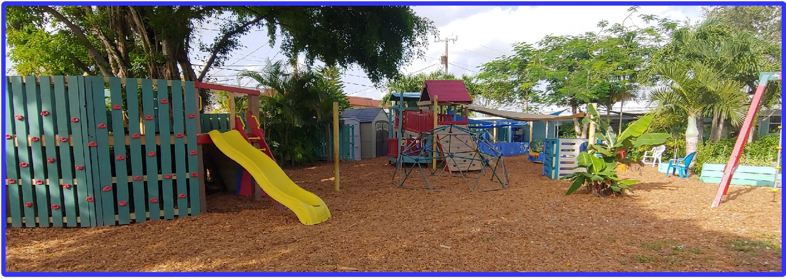 School playground with slide and shaded play areas
