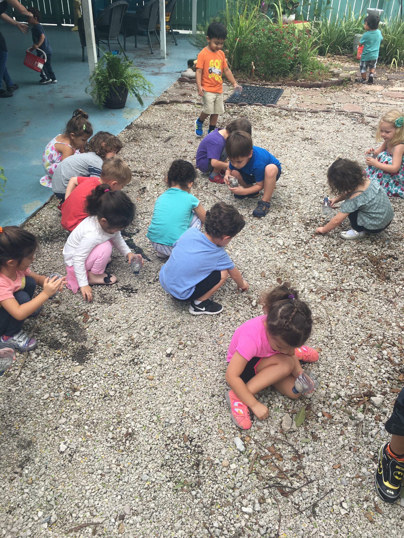 Children exploring together outdoors during an activity